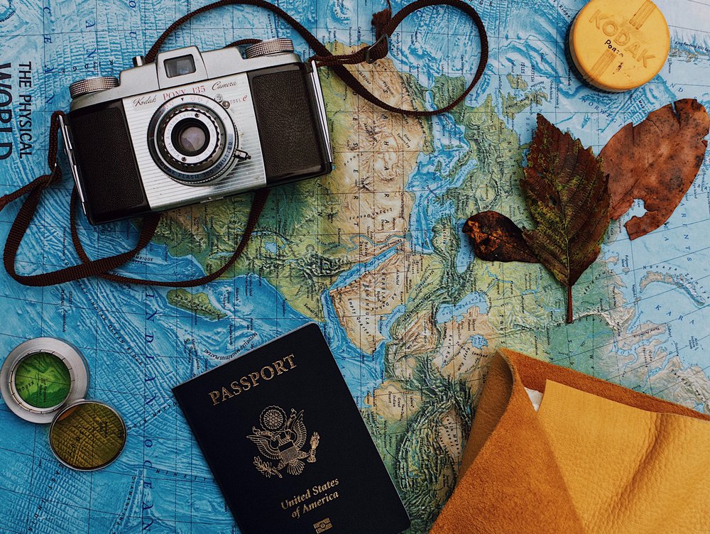 Travel map, passport, camera, keepsakes